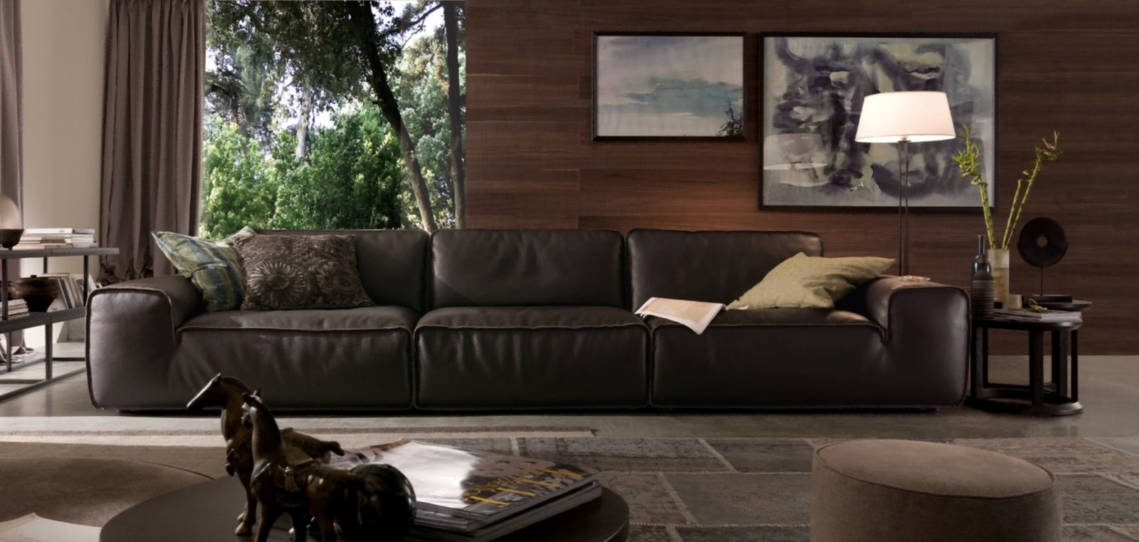 Dark smooth upholstered sofa with separate seat and back cushions in a furnished room
