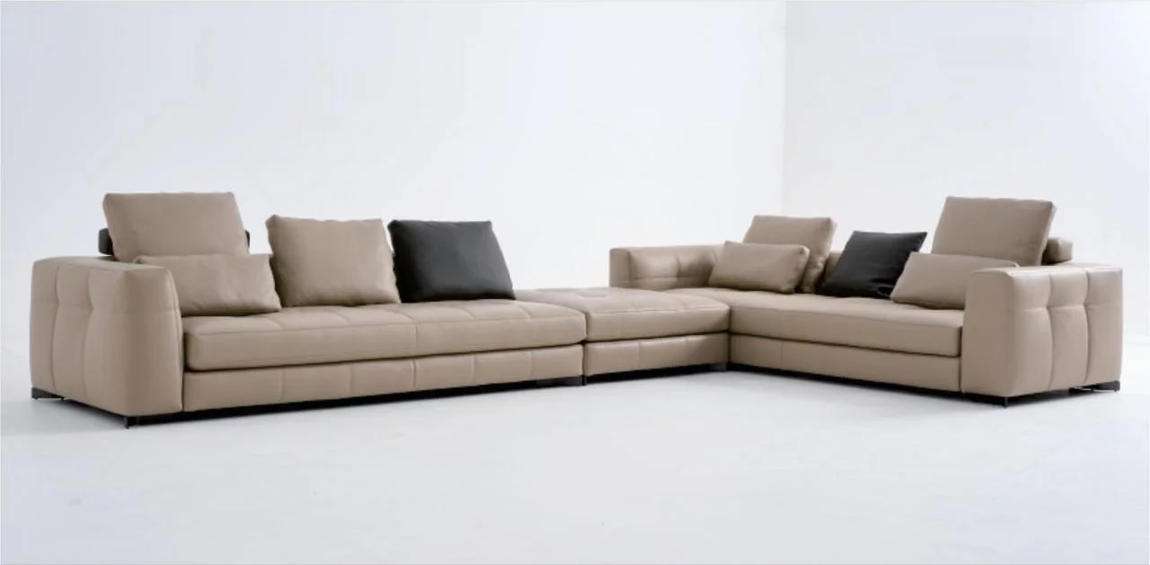 Taupe sectional sofa with broad seat cushions and loose back cushions