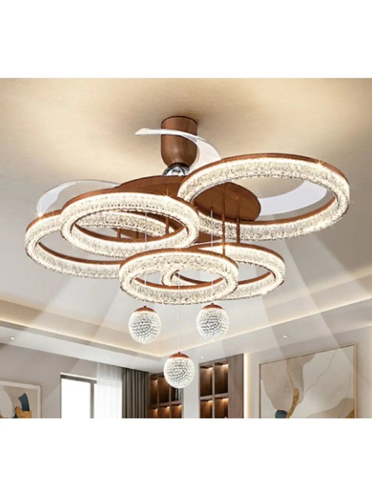 Layered circular ceiling light with bright rings and hanging decorative spheres