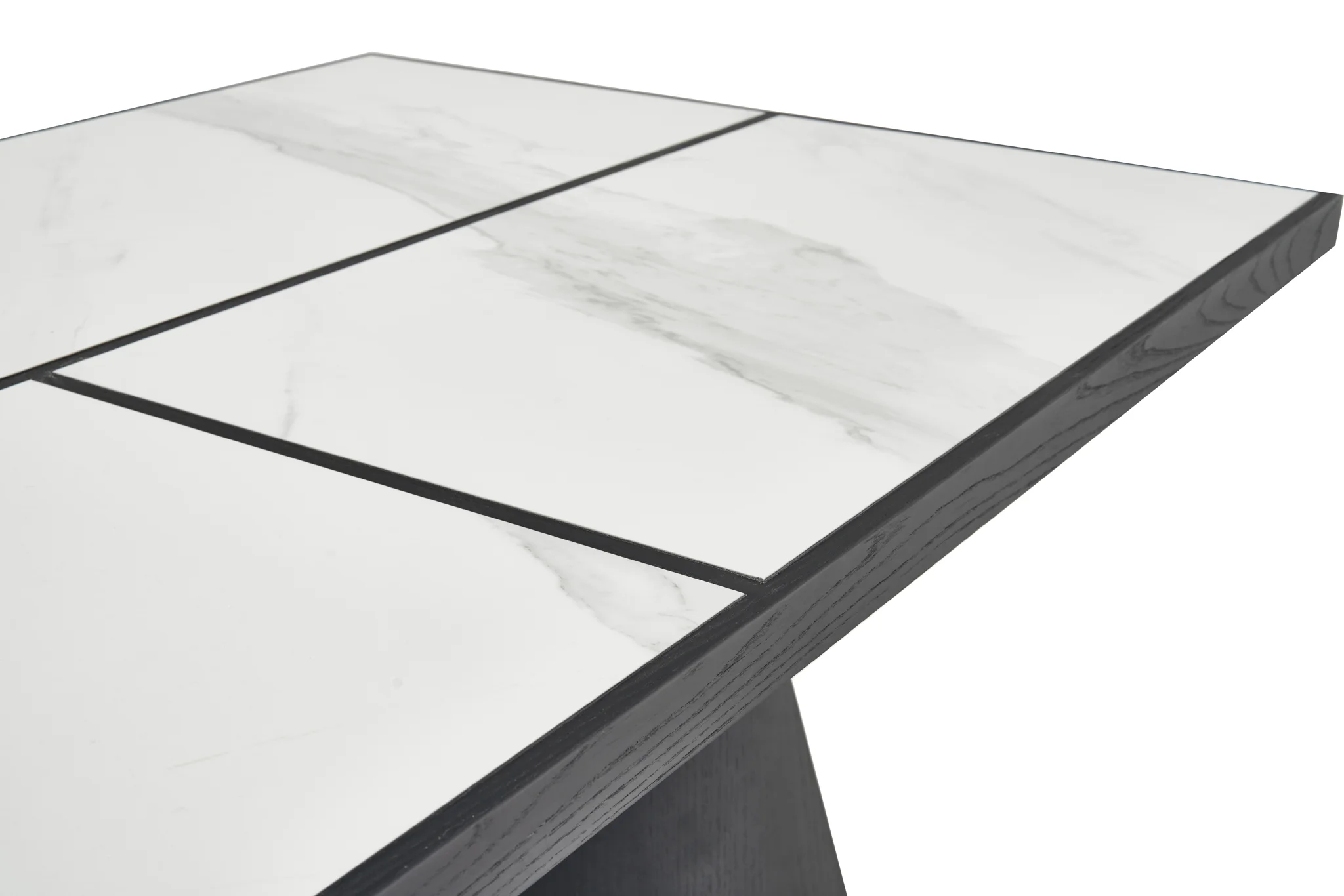 Close view of pale veined dining-table surface and its rounded edge