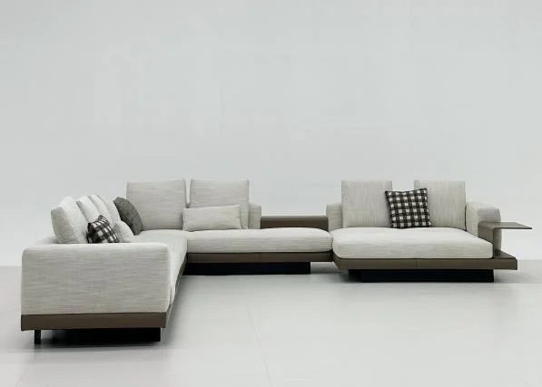 Light sectional sofa with its projecting return on the left when viewed from the front