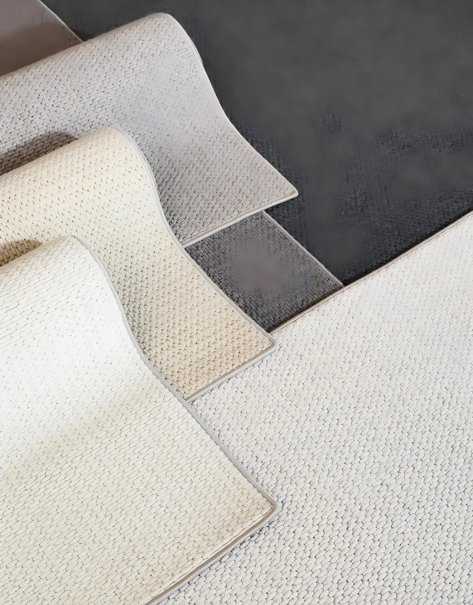Textured textile samples displayed together for colour and surface comparison