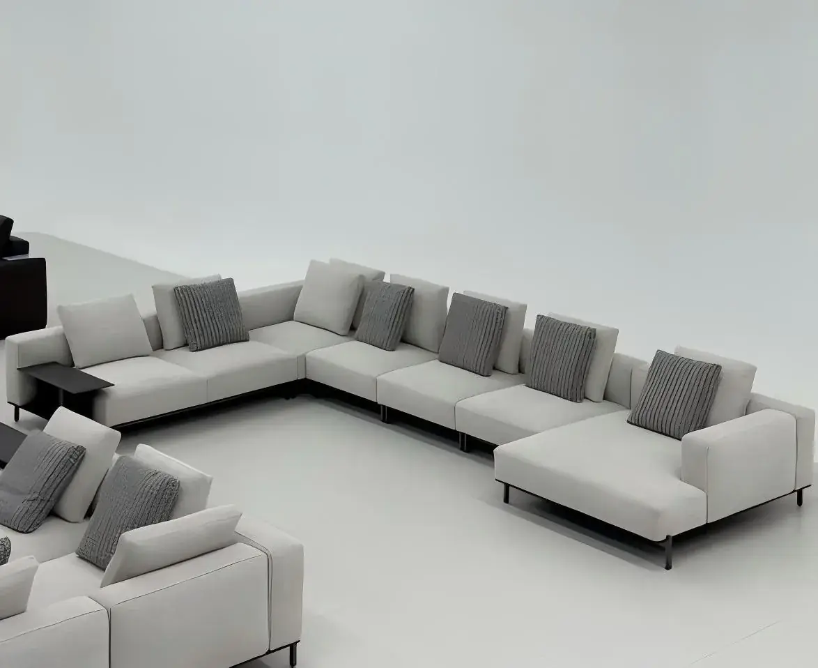 Light grey U-shaped sectional seating arrangement with a separate ottoman