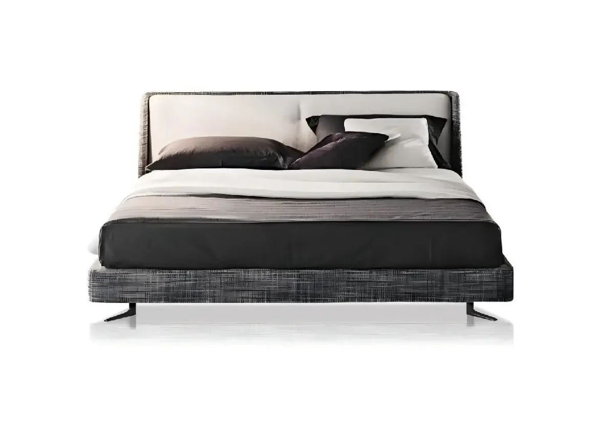 Upholstered bed raised above the floor on angular dark legs